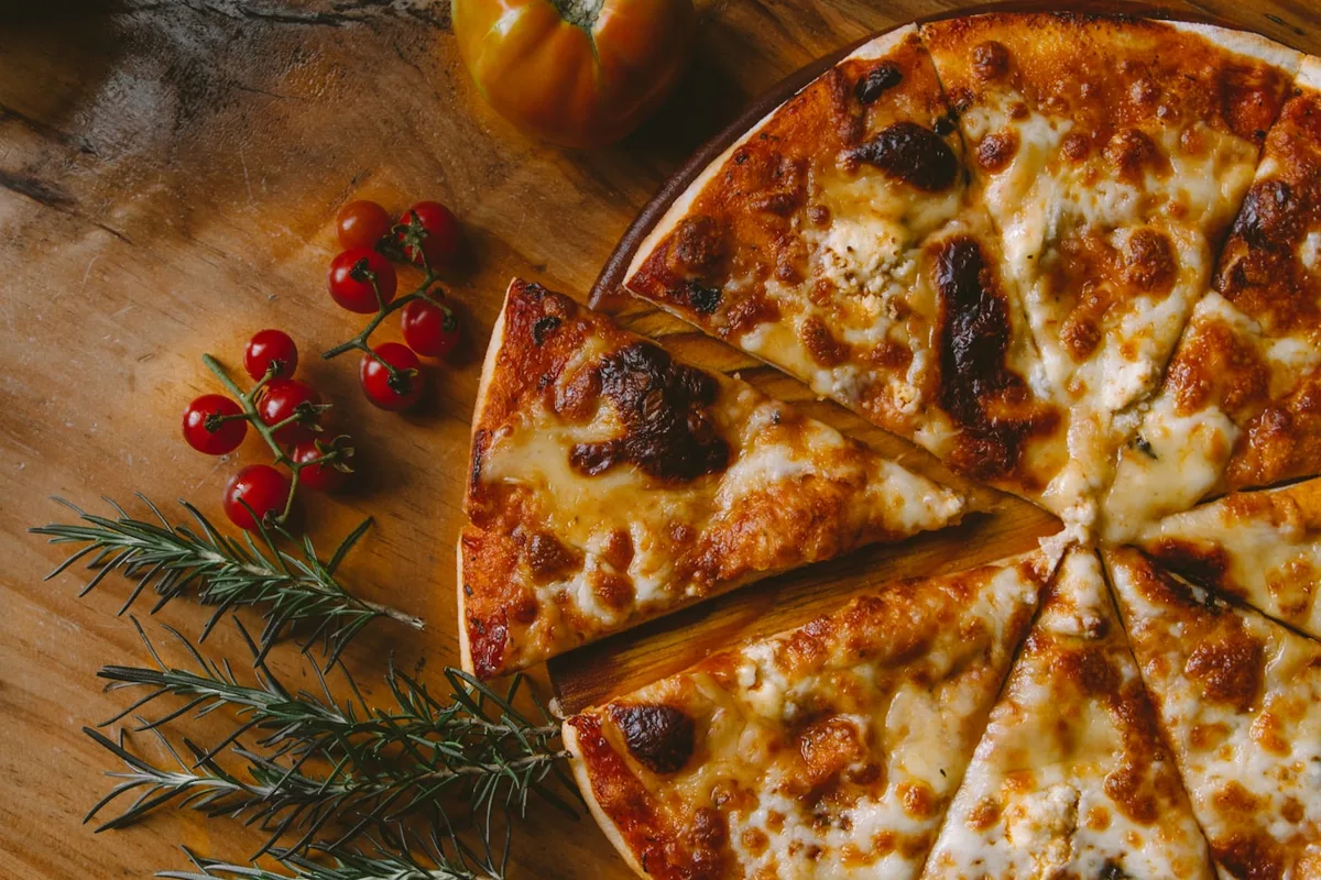 A margherita pizza with charred leopard-spotted crust
